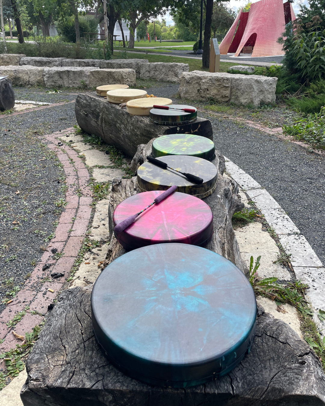 Hand drums ready for the circle at the Winnipeg end-of-summer Mikanah Gathering